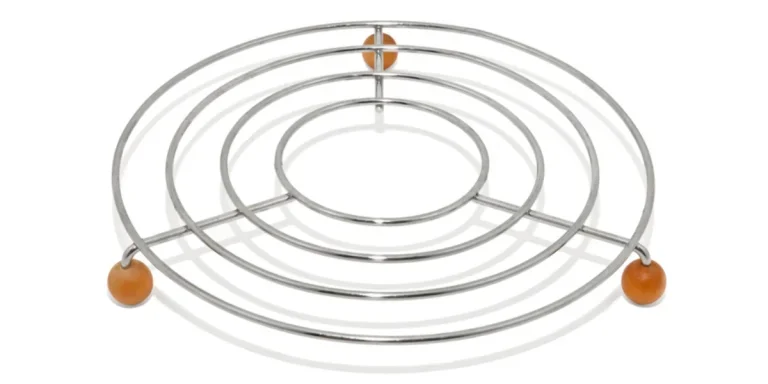 Stainless steel trivet on white background