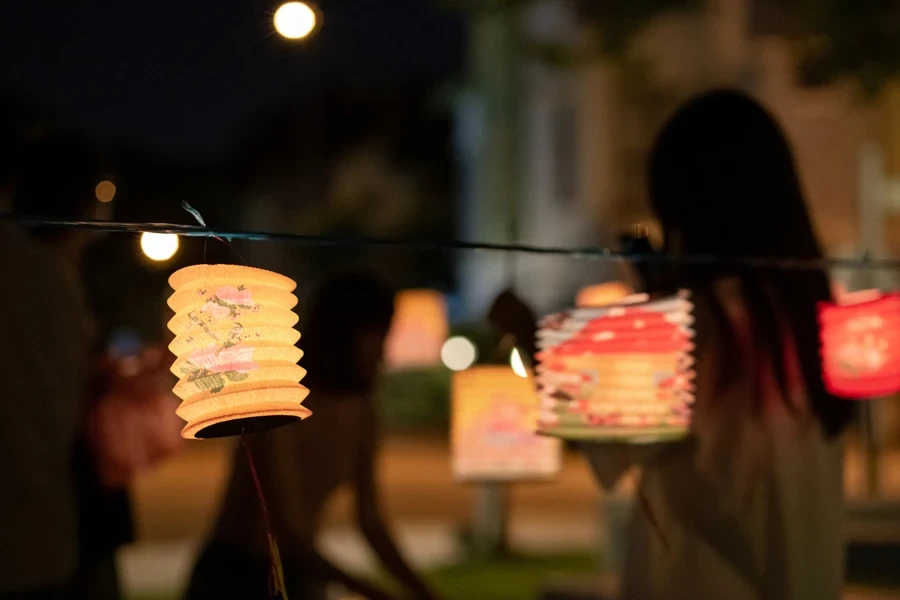 String of decorative solar lanterns at outdoor party