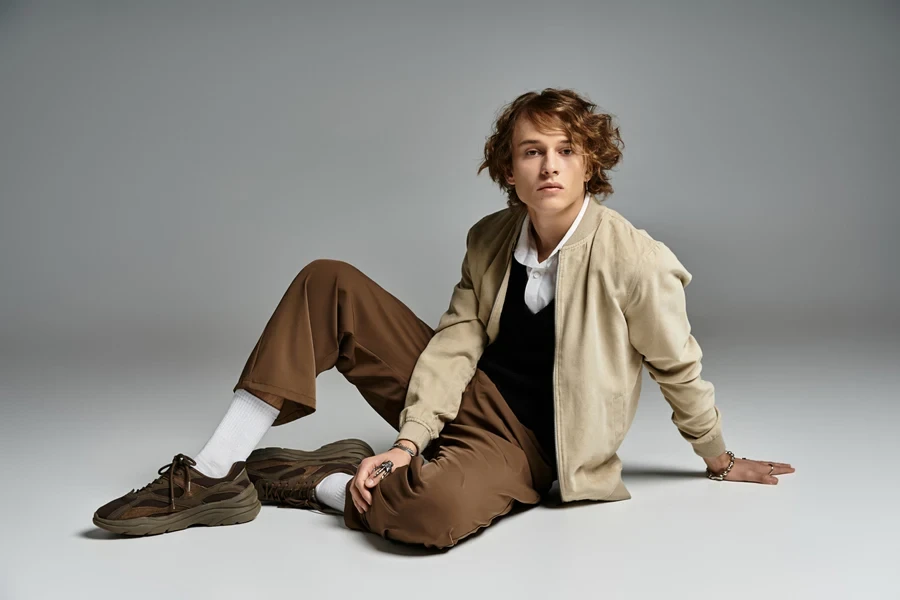 Stylish young man in brown neutral outfit