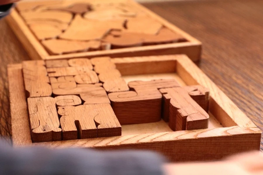 Two boxes of wooden puzzles