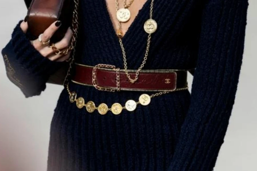 Woman in gold coin chain belt