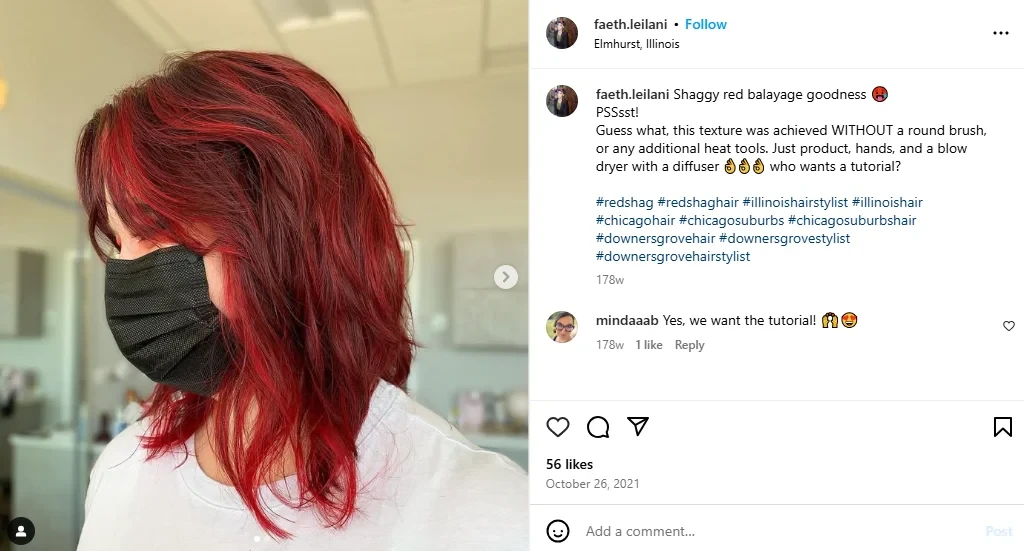 Woman showing her red shag hair from the side