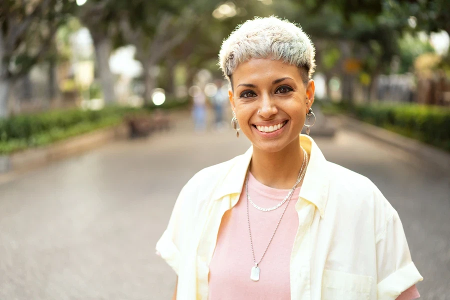 Woman standing in street wearing sterling silver snake chain necklace