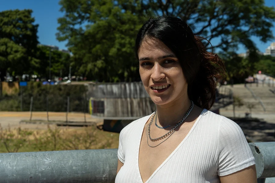 Woman wearing multiple layered chains with white t-shirt