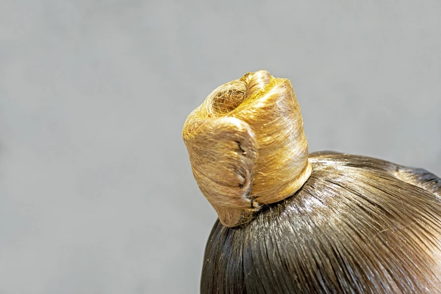 Woman with a slicked back high ponytail