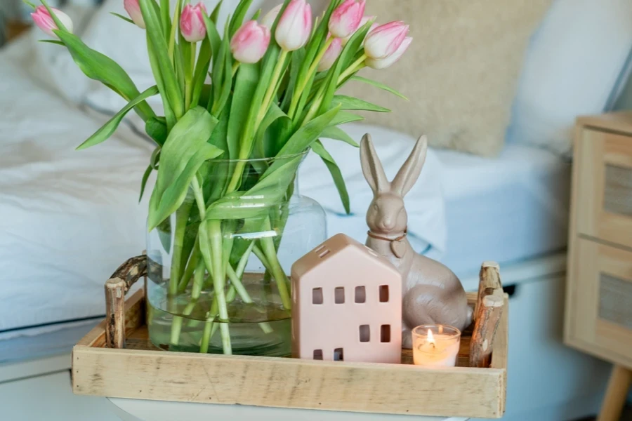 Wooden table centerpiece with décor items on it