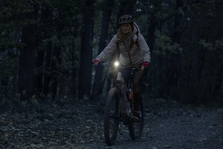 Young woman on a night e-bike ride