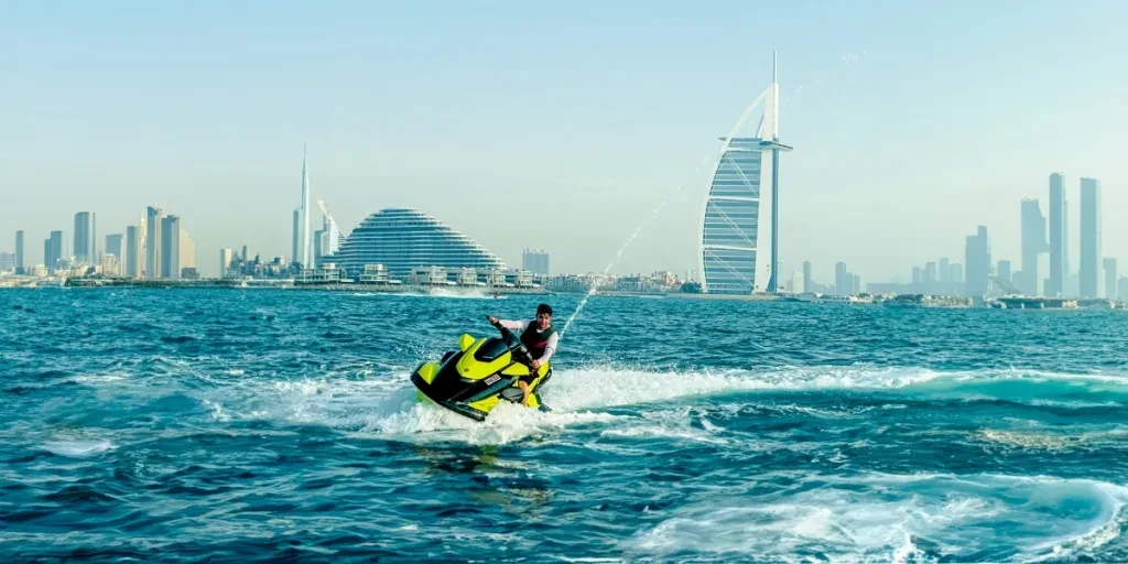 a man riding a jet ski on top of a body of water