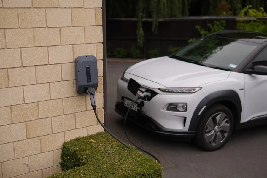 A White car charging with a EV home charger