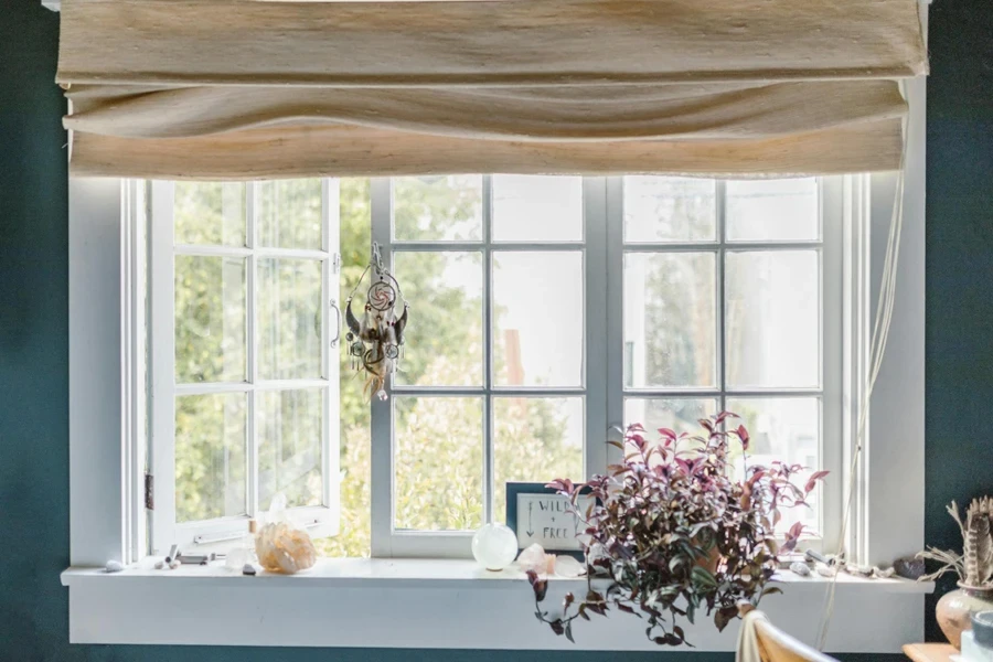 A beige colored curtain robot in a home
