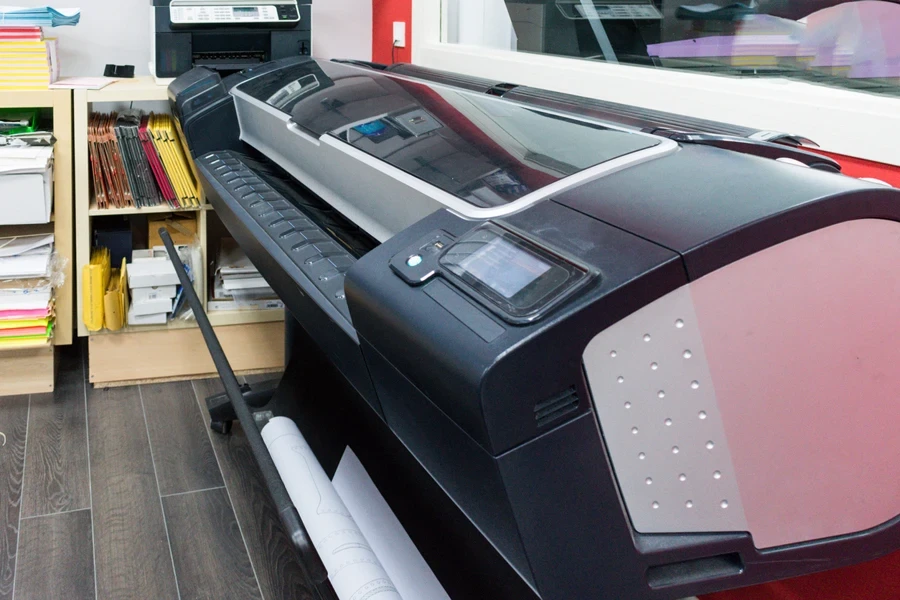A black roll-to-roll large-format printer