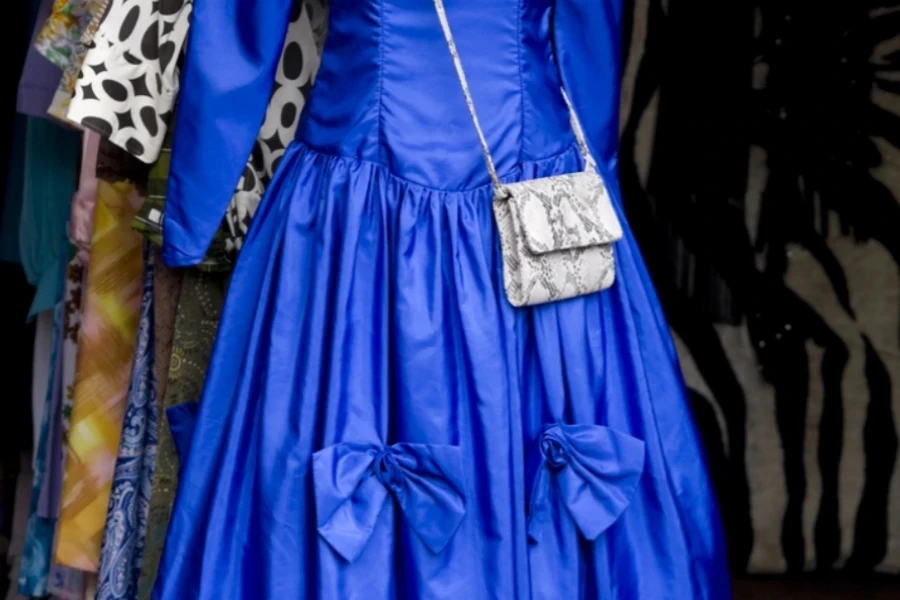 A blue bow dress with bows below the waistline