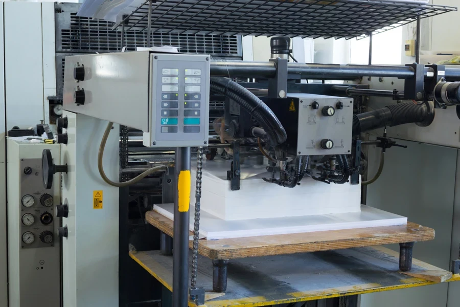 A die cutter with a stack of paper