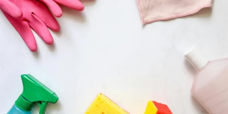 A flat lay of assorted cleaning supplies, perfect for housekeeping themes