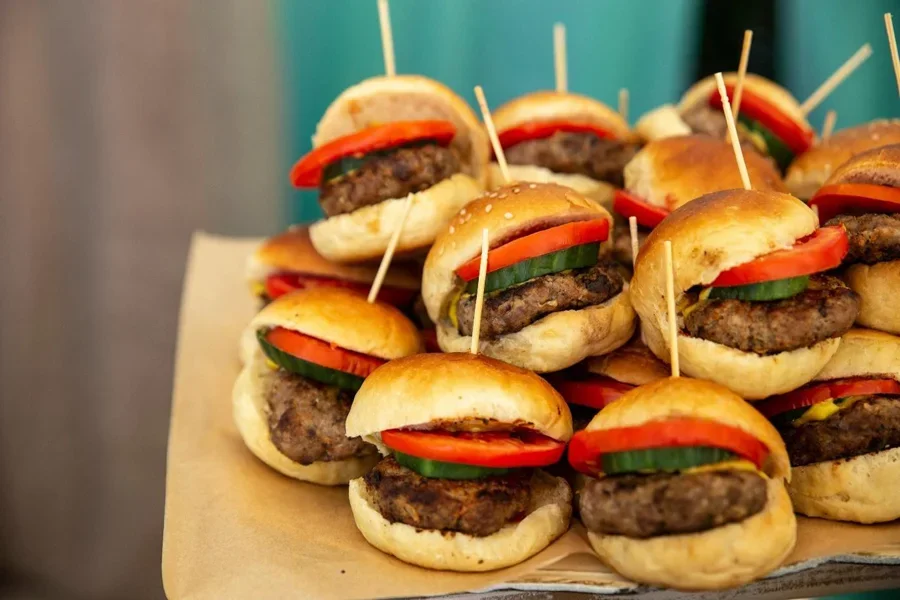 A group of burgers on a tray