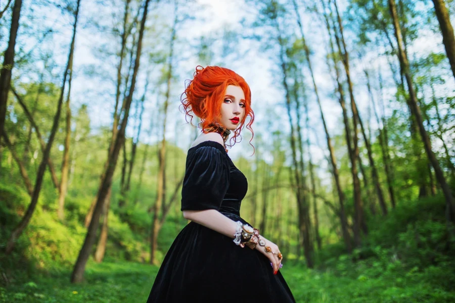 A lady wearing a velvet gothic dress