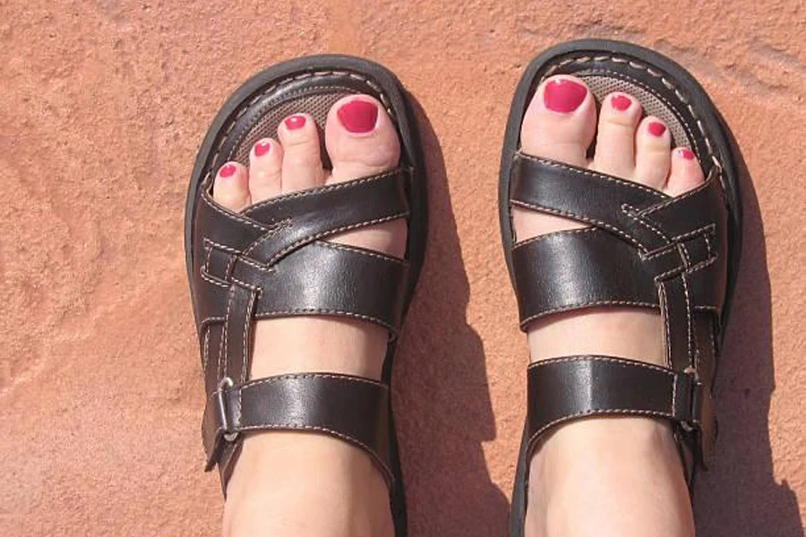A lady wearing wide-toe sandals