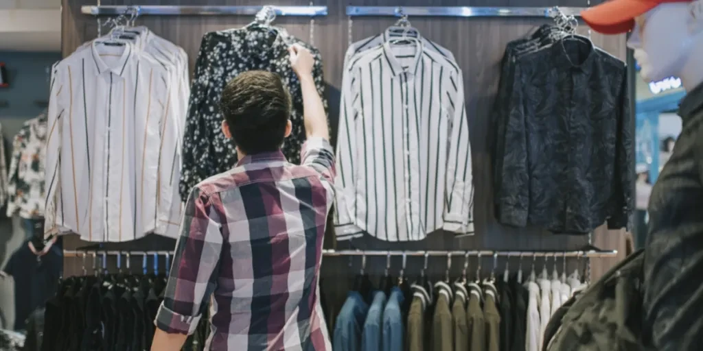 A man checking clothes in a store