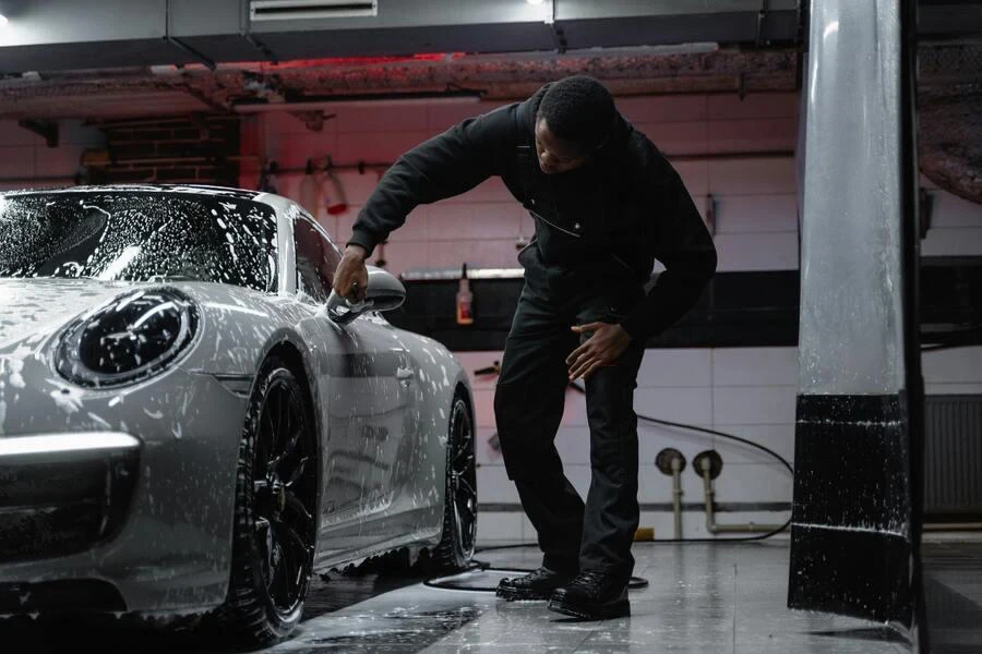 A man washing car in a service station