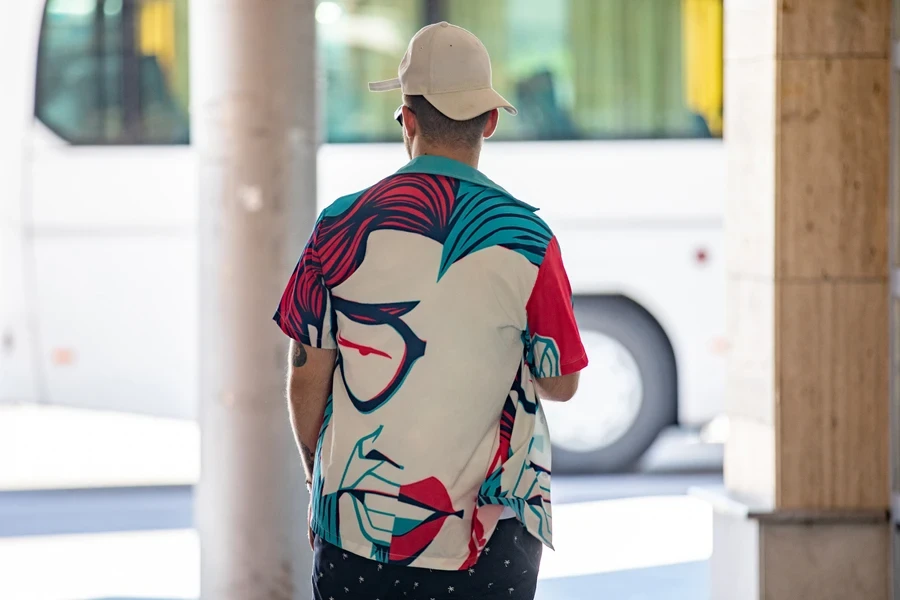 A man wearing an oversized graphic shirt