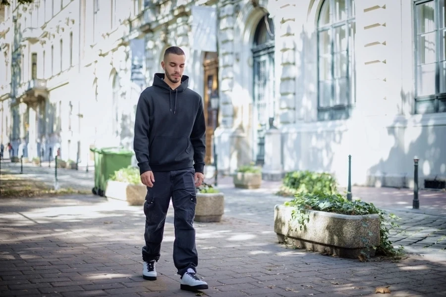 A man wearing cargo pocket sweatpants