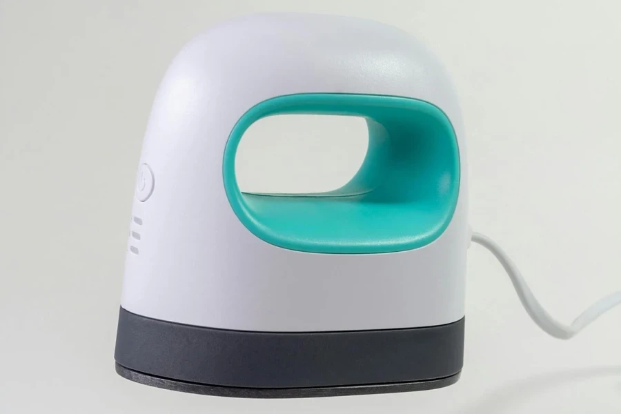 A mini heat press on a white background