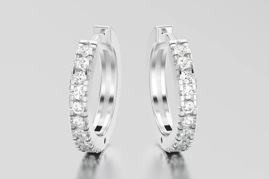 A photo of inside-out moissanite huggie hoops
