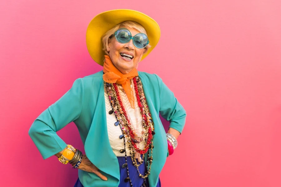 A senior woman in fancy 80s fashion and accessories