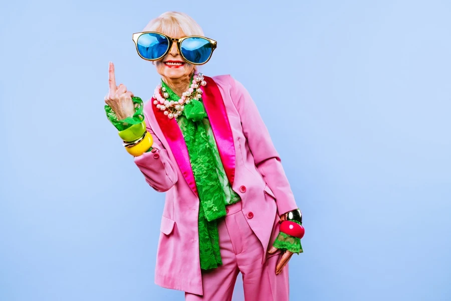A senior woman wearing chunky jewelry