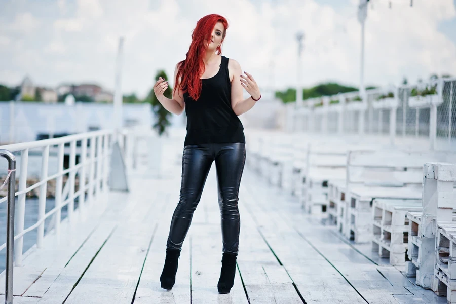 A woman wearing bad girl vegan leather pants
