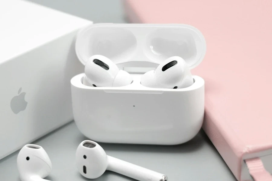 AirPods Pro in their case with AirPods on the table in front