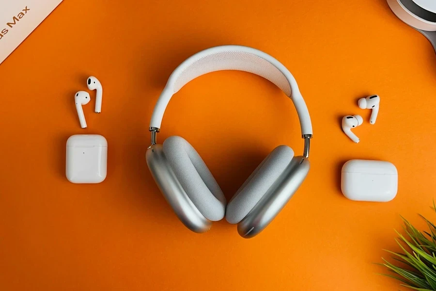All three AirPods models on an orange background