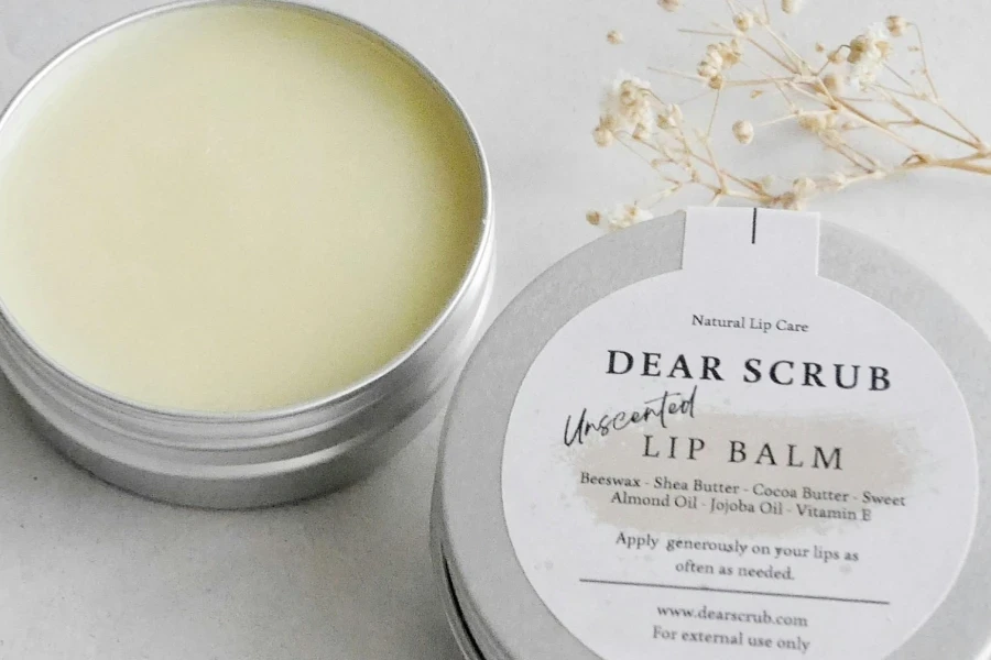 An open lip balm on a white background