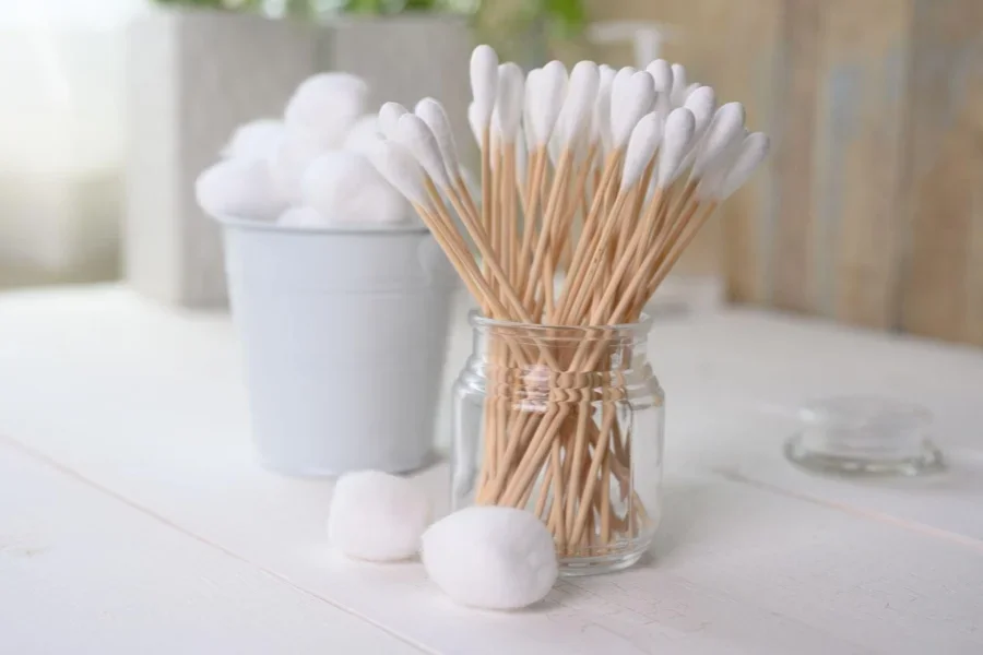 Background of white cotton swabs, buds and balls