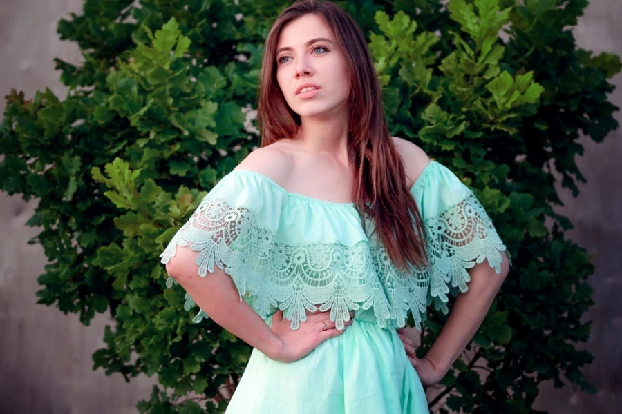 Beautiful woman in a light mint laced dress
