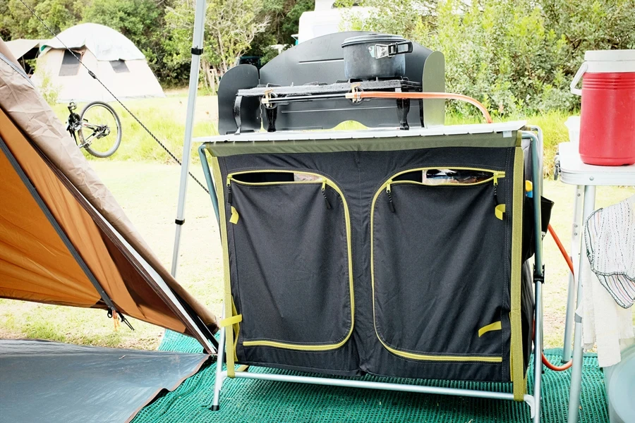 Camping cooking station with zippers