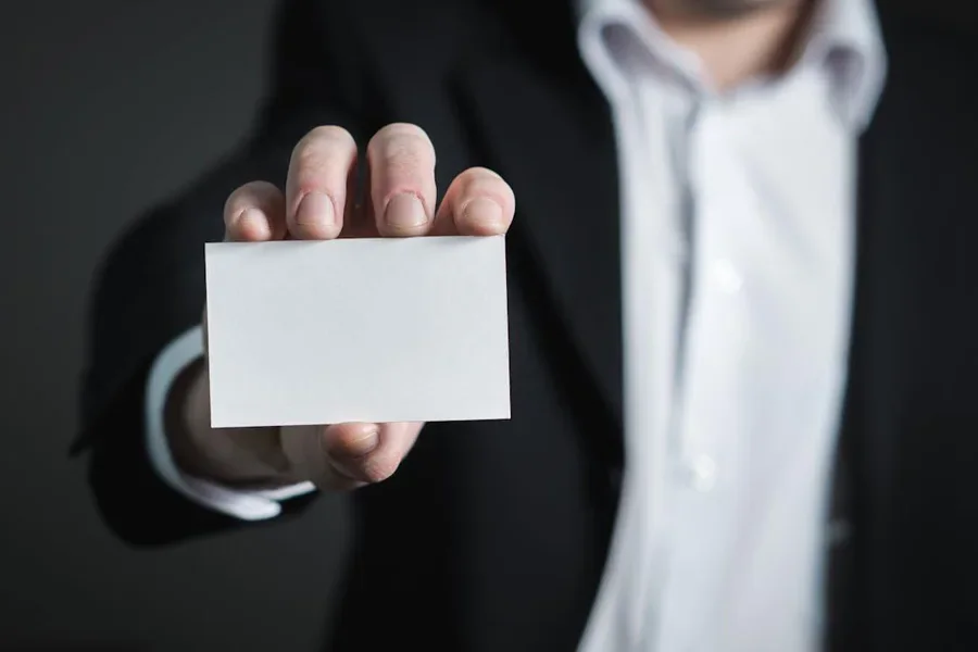 Close-up of a hand holding a blank card