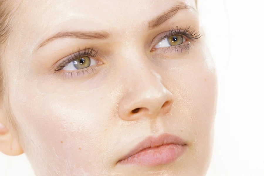 Close up of woman’s face with little makeup on