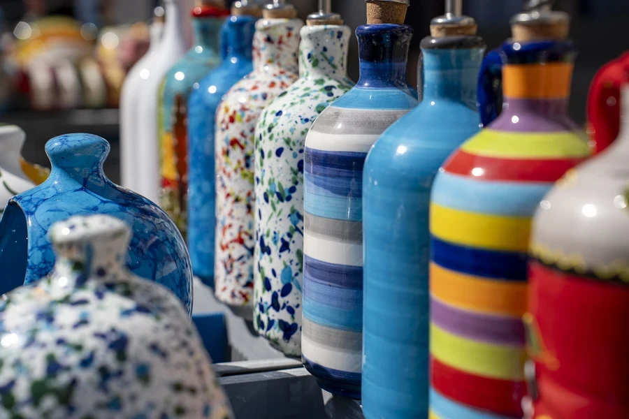 Colorful ceramic oil dispensers and vinegar bottles with lids