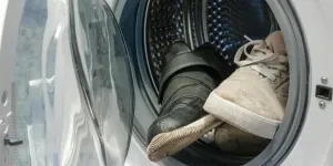 Dirty shoes in a shoe-washing machine