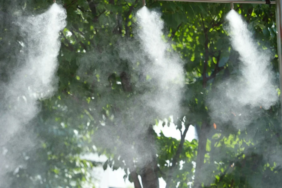 Dry micro-misting system in action in an orchard