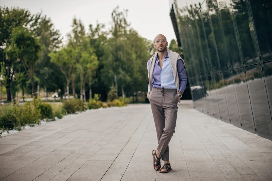 Handsome, fashionable man in drawstring pants and sandals