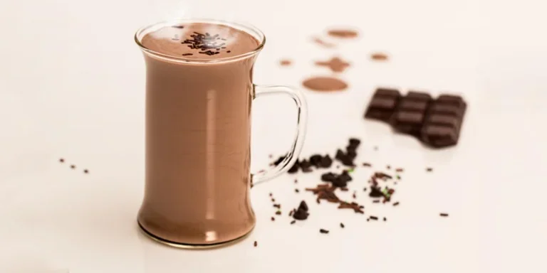 Hot chocolate drink in front of chocolate bar