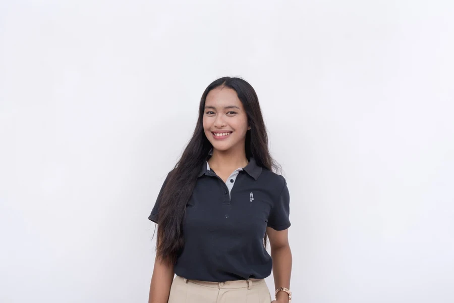 Lady wearing an embroidered tiny chest patch shirt