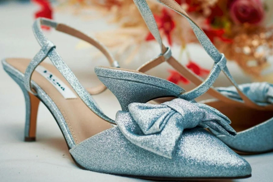 Light blue glitter slingback heels with a bow
