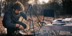 Man preparing food in a camping kitchen