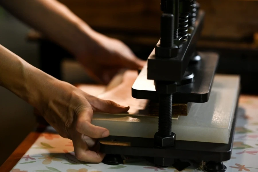 Man using a flat-bed press