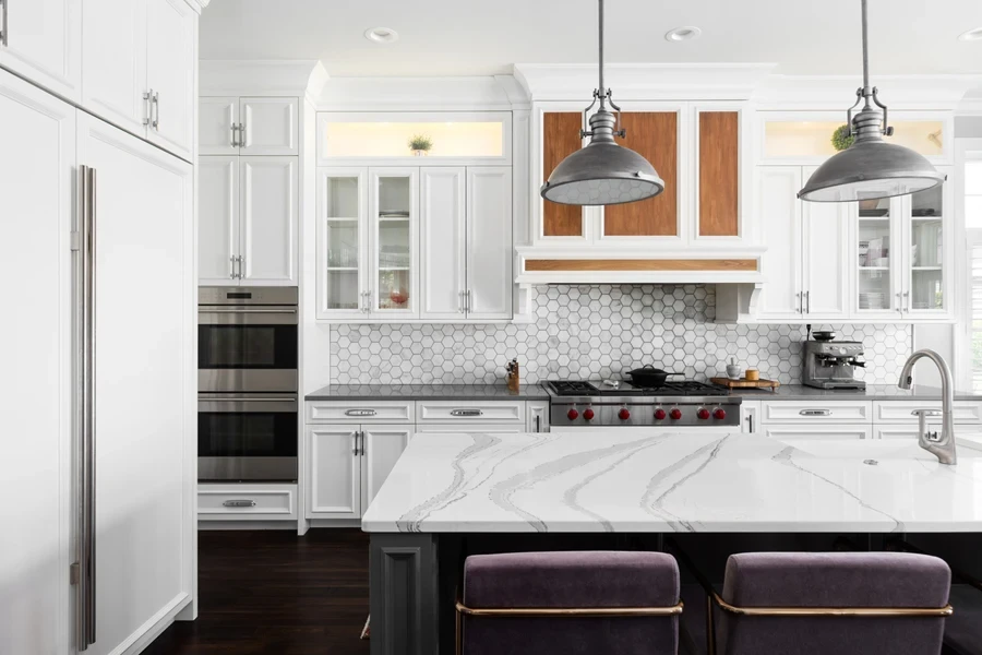 Modern kitchen with marble countertops and white decor