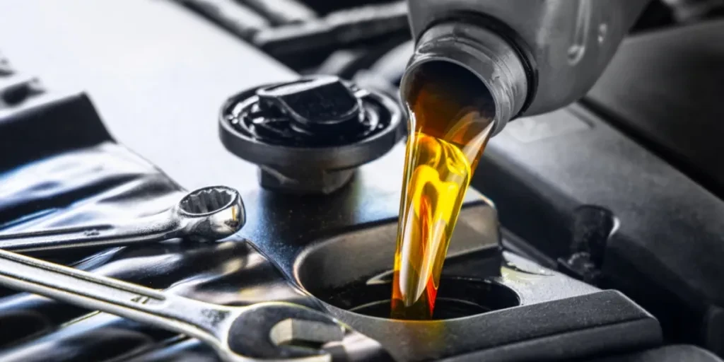 Motor oil being poured into a vehicle
