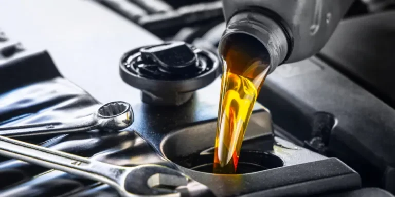 Motor oil being poured into a vehicle